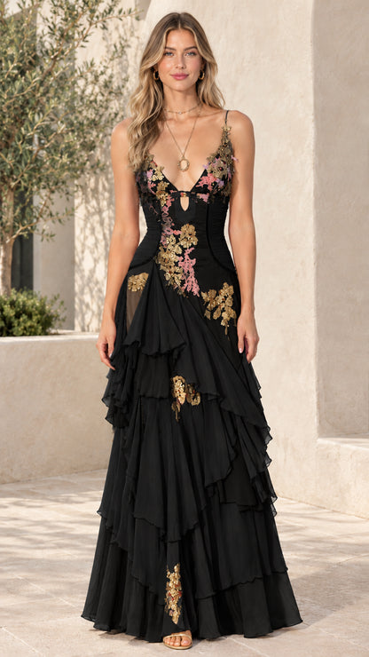 Front view of model wearing Black tiered ruffle embroidered maxi dress