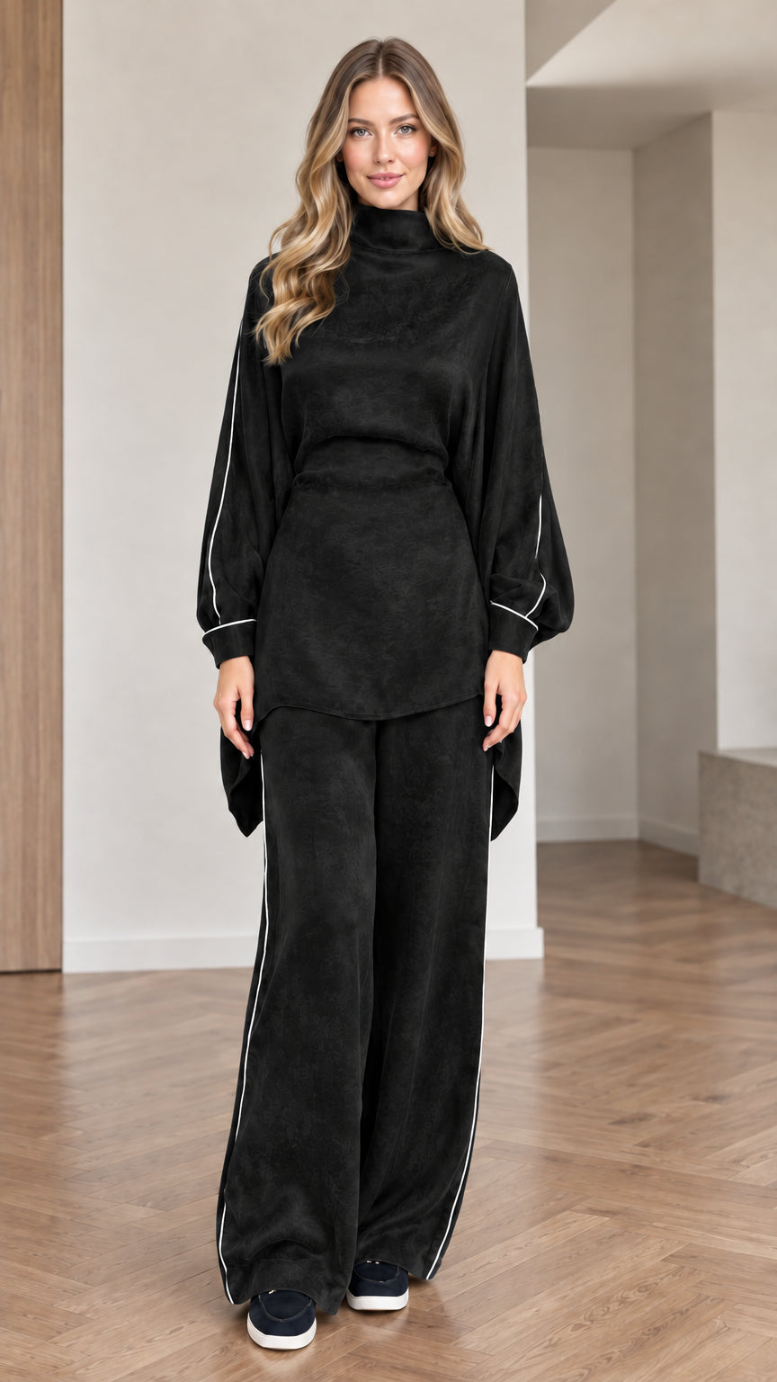 Front view of women wearing black mock neck tunic top and matching wide leg pants set