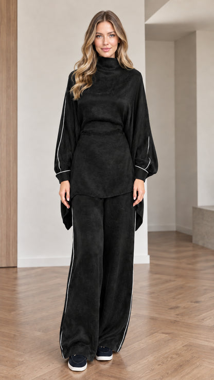 Front view of women wearing black mock neck tunic top and matching wide leg pants set