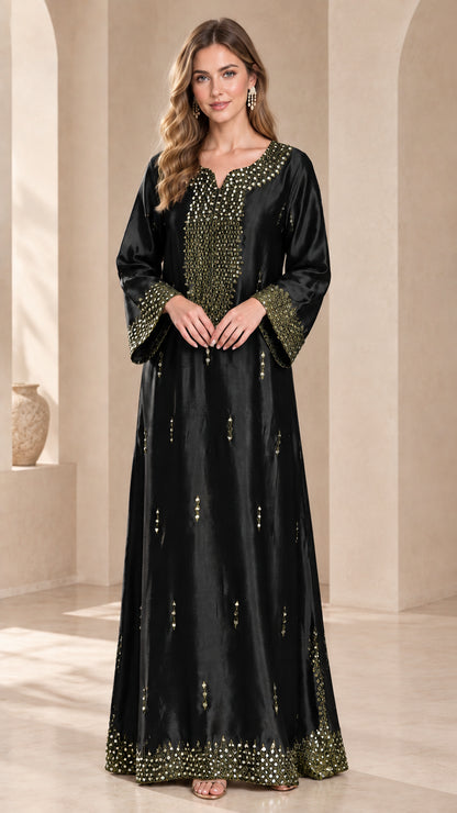 Model wearing a black embellished satin kaftan dress