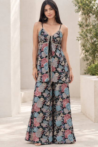 Model wearing Black floral print sleeveless tunic top and wide-leg palazzo pants set