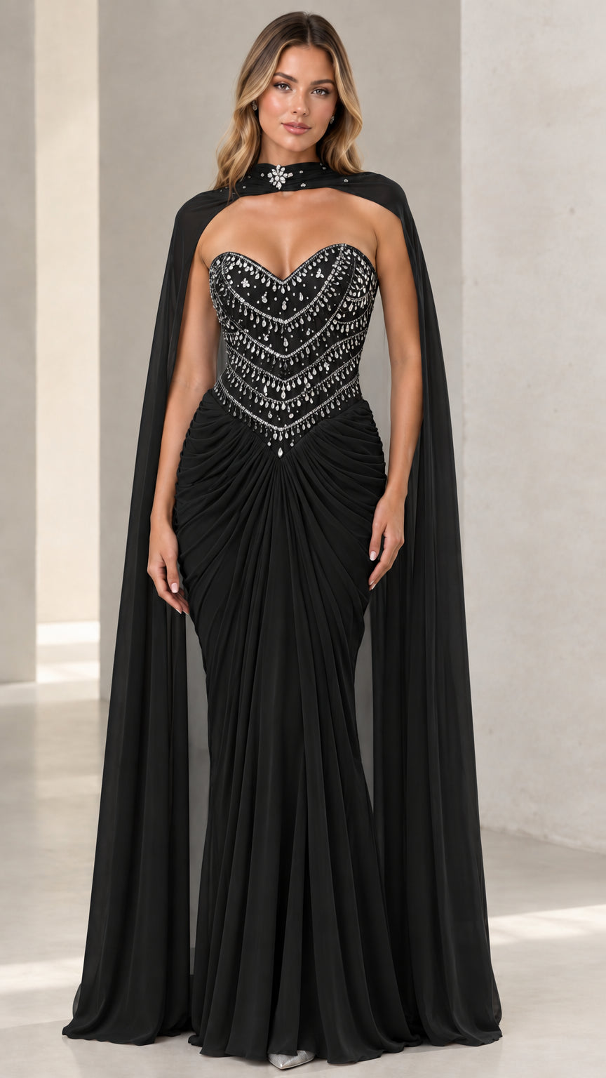 Black embellished sweetheart corset evening gown with matching sheer cape
