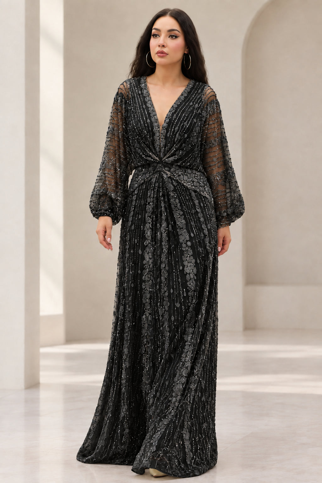 Front view of Black beaded long sleeve maxi evening gown
