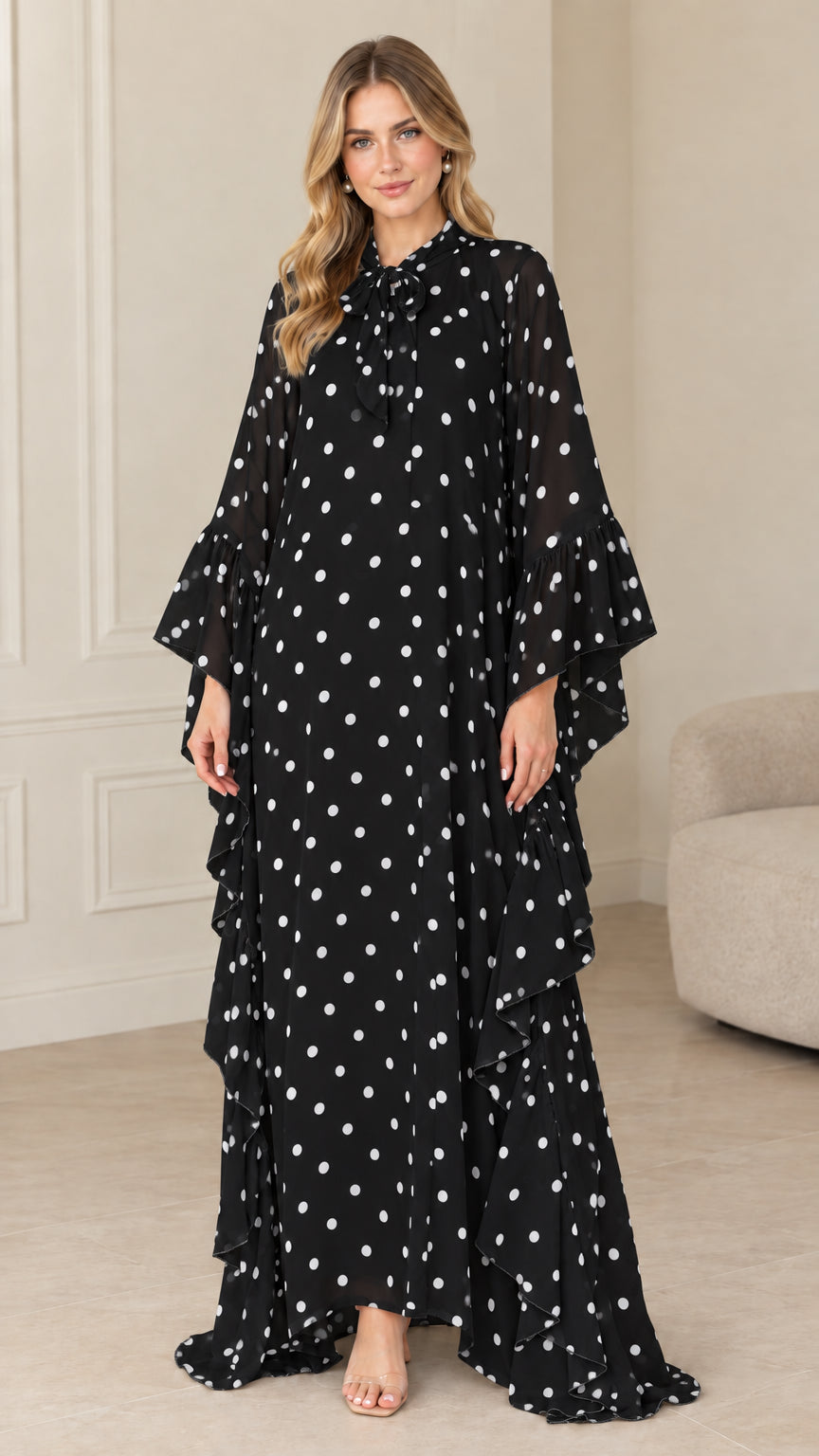 Full front view of black polka dot tie neck ruffle kaftan maxi dress