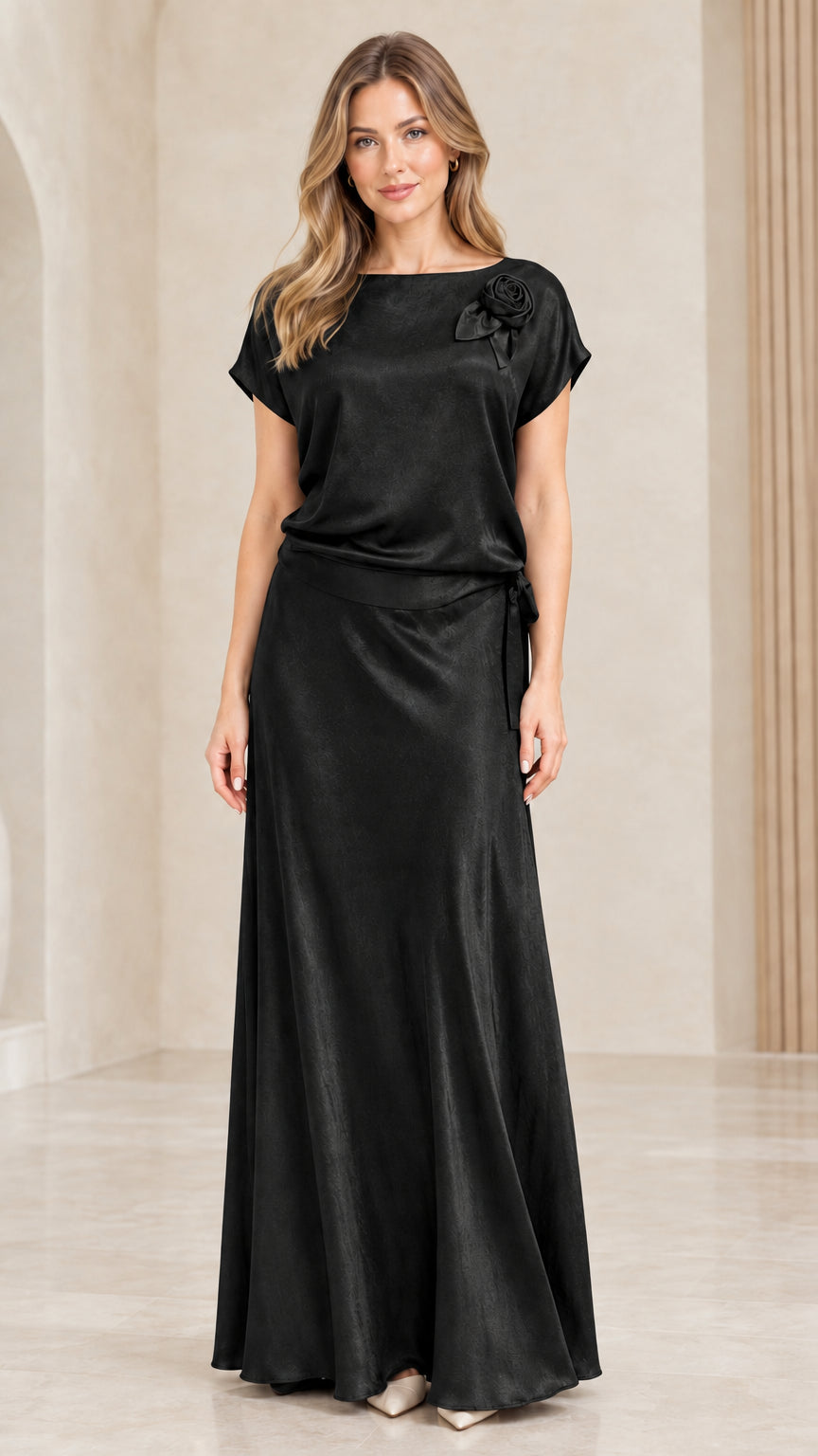 Full-length front view of woman wearing Black satin evening maxi gown
