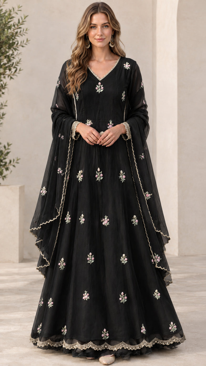 Front view of model wearing black floral embroidered maxi dress set