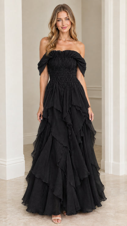 Front view of model wearing Black off-the-shoulder tiered ruffle maxi gown