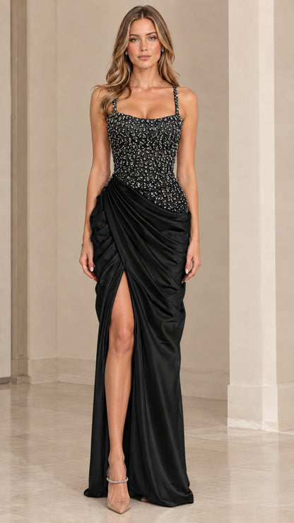 Model wearing black beaded corset satin maxi dress with slit