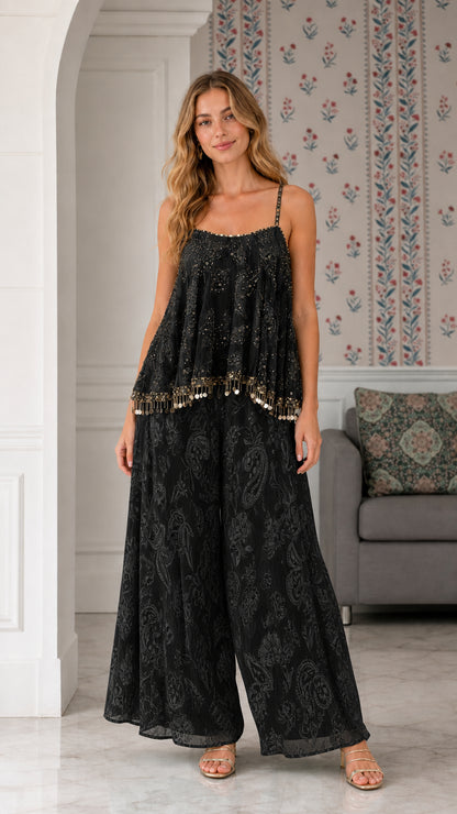 Model wearing black sequin embroidered cami and palazzo pant two-piece set