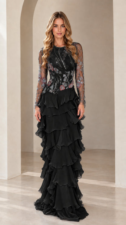 Front view of model wearing Black embroidered long sleeve tiered ruffle evening gown