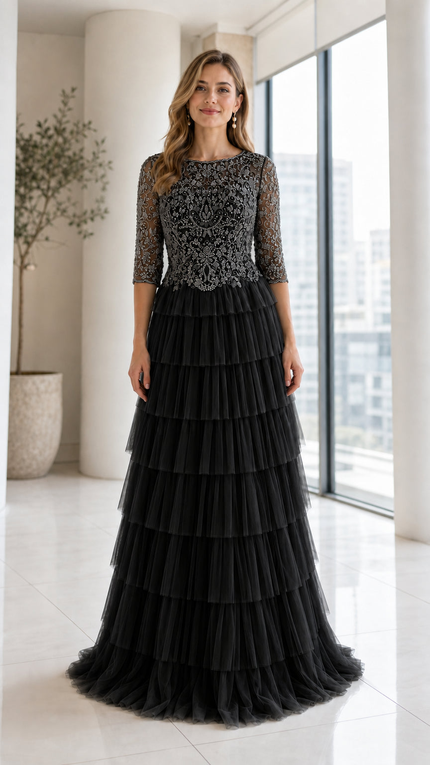 Front view of model wearing Black beaded bodice tiered tulle evening gown