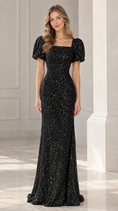 Model wearing black puff sleeve square neck sequin formal evening gown