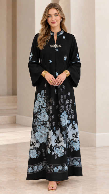 Black embroidered kaftan maxi dress with light blue floral motif and brooch neckline