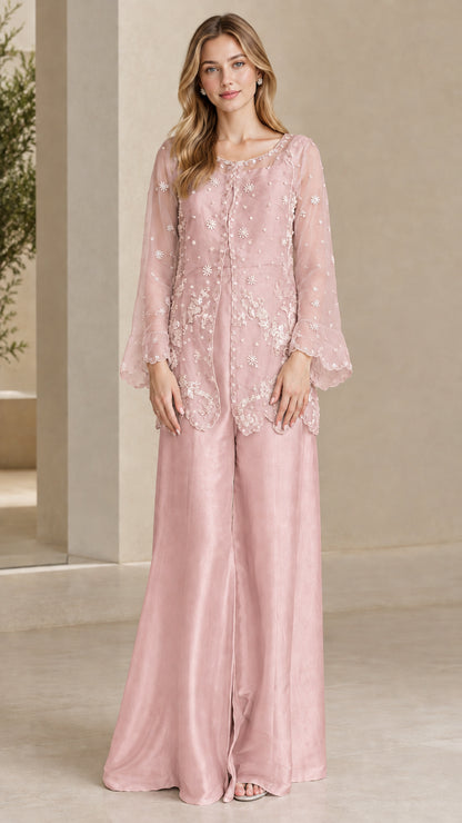 Model wearing Dusty Pink embroidered tunic top and flowing wide leg trousers