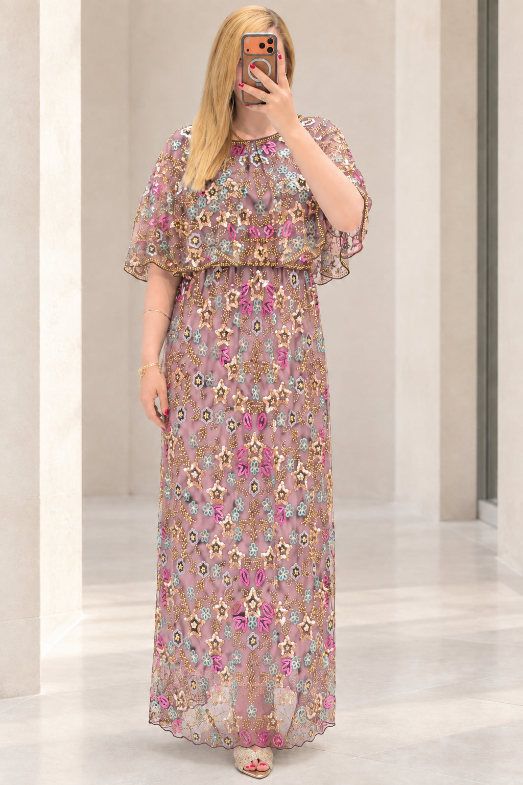 Front view of dusty pink floral sequin embroidered capelet maxi dress
