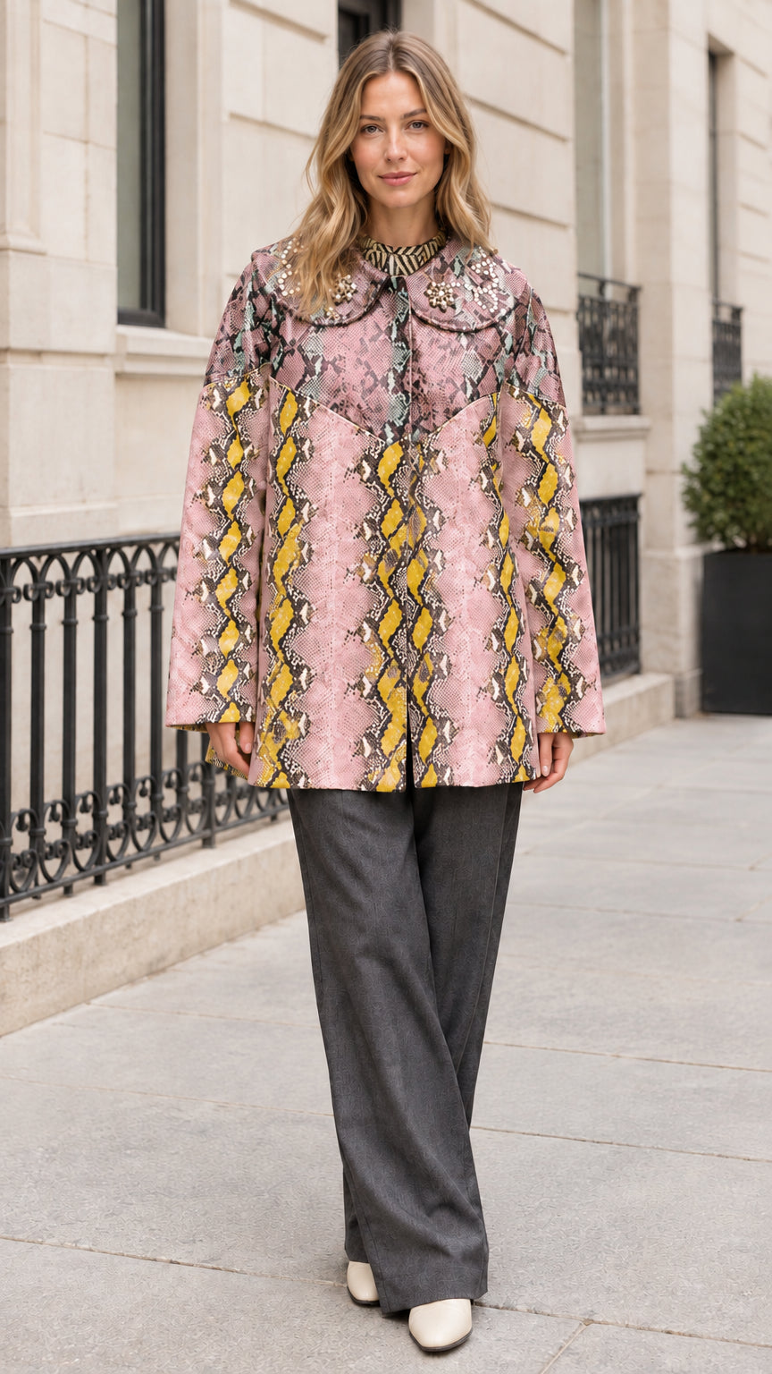 Model wearing Pink Yellow snakeskin print coat