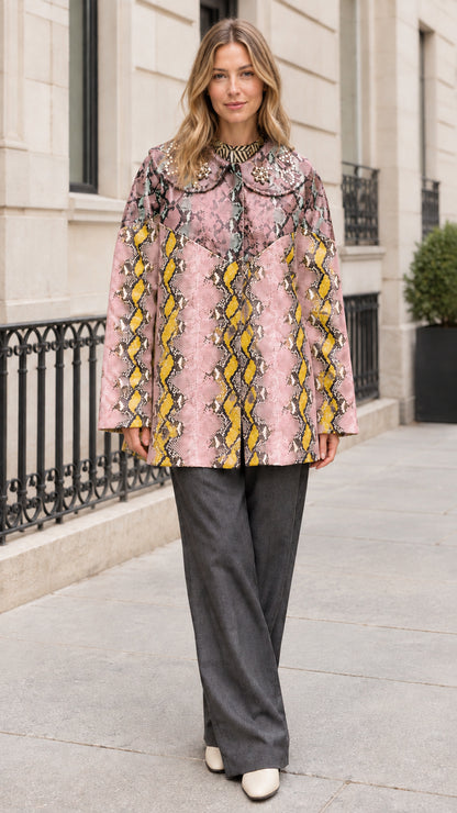Model wearing Pink Yellow snakeskin print coat