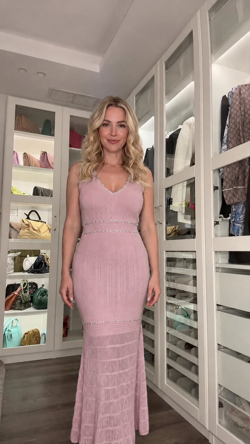 Front view of woman wearing dusty pink sleeveless knit maxi dress