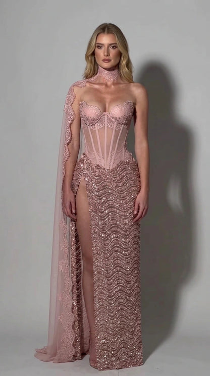 Full front view of blush pink sequin corset gown with high slit and matching cape