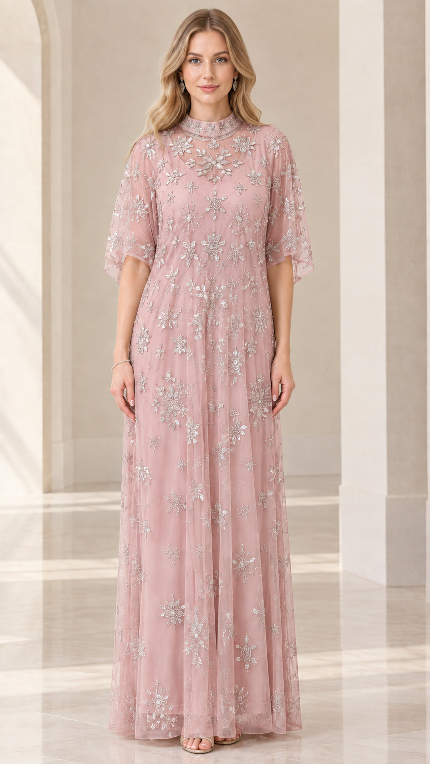 Front view of woman wearing dusty rose beaded mock neck formal dress