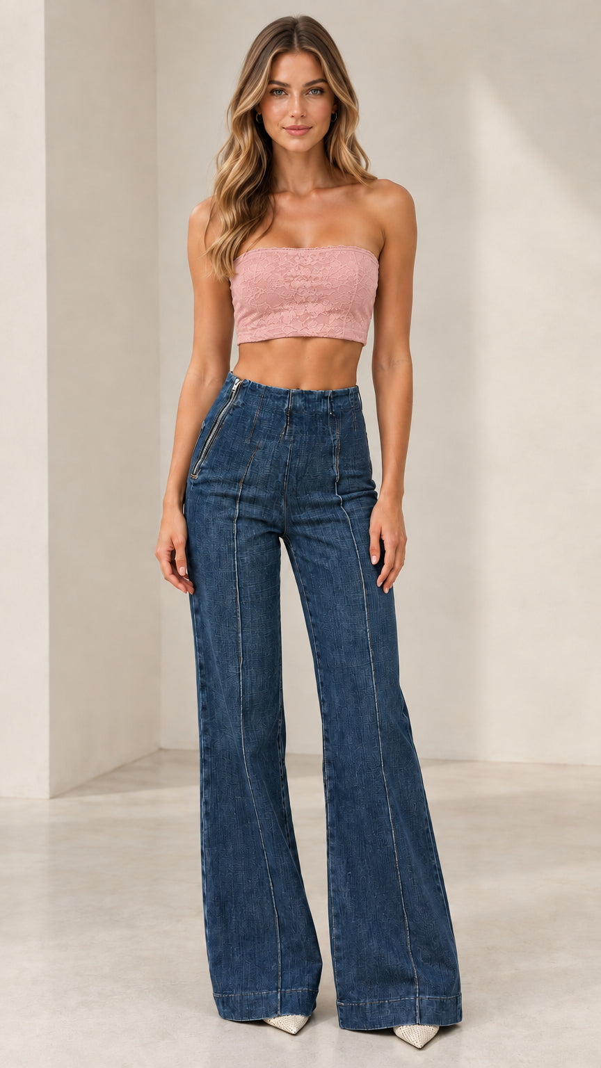 Model wearing Classic Blue high-rise flare jeans paired with pink crop top