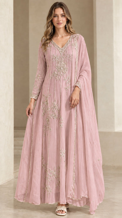 Model wearing blush pink embroidered A-line evening dress with matching drape