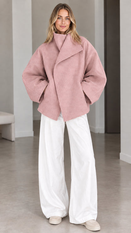Model wearing dusty pink fold-over collar relaxed short coat