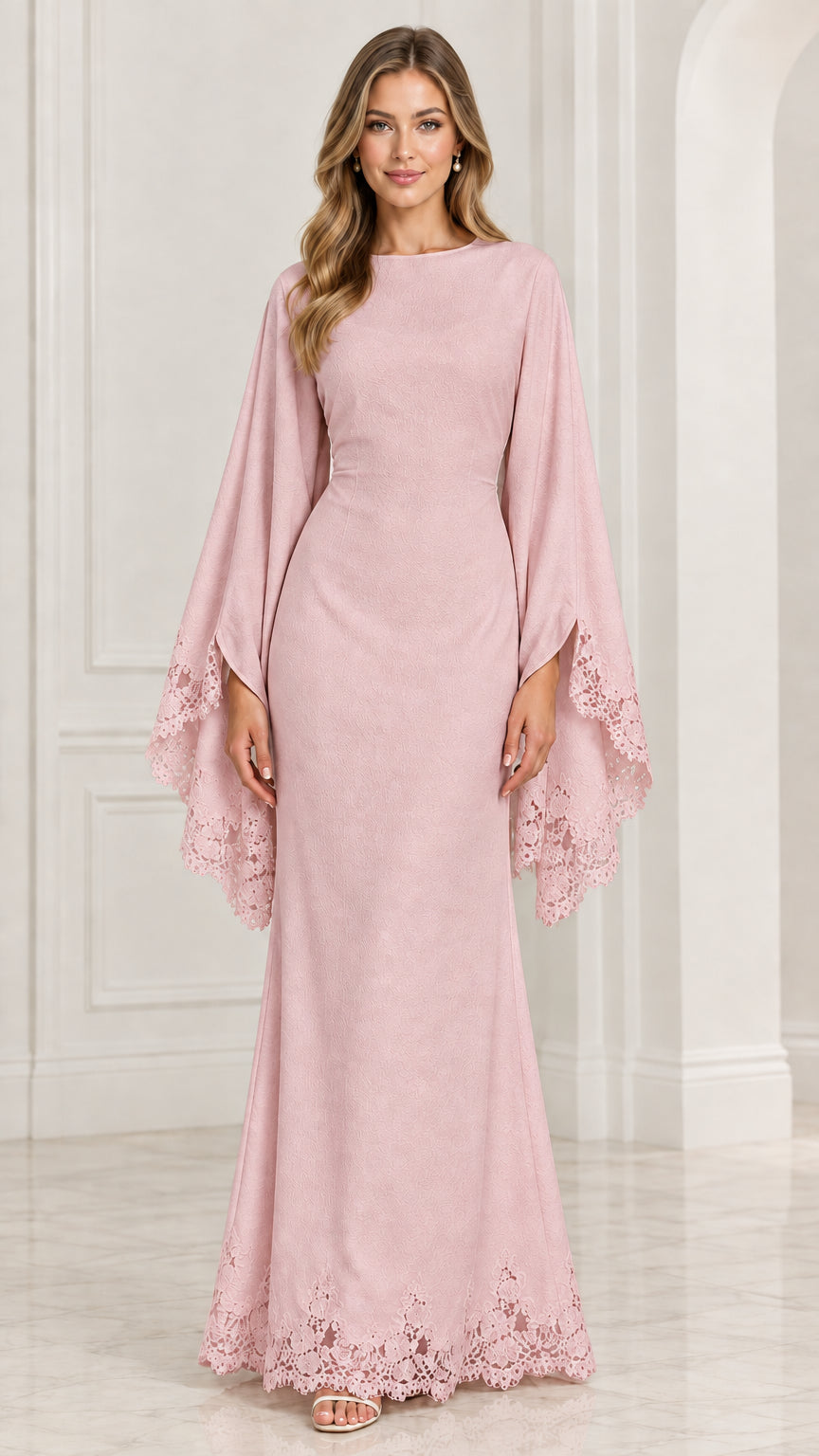 Front view of model wearing blush pink cape sleeve formal dress with lace trim