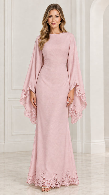 Front view of model wearing blush pink cape sleeve formal dress with lace trim
