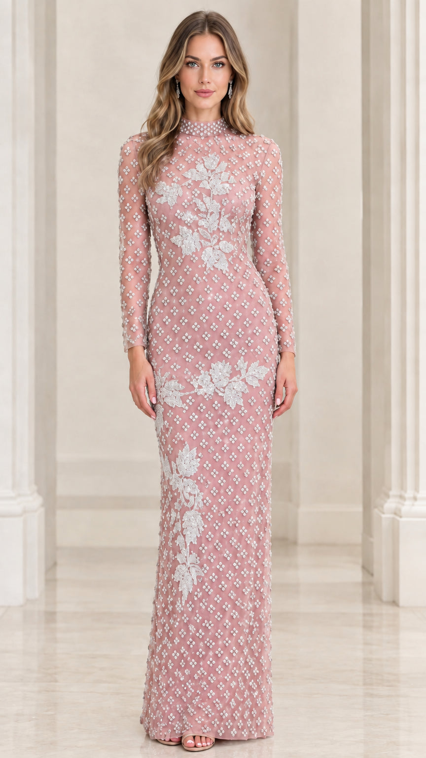 Front view of blush pink beaded long sleeve formal dress with floral embroidery