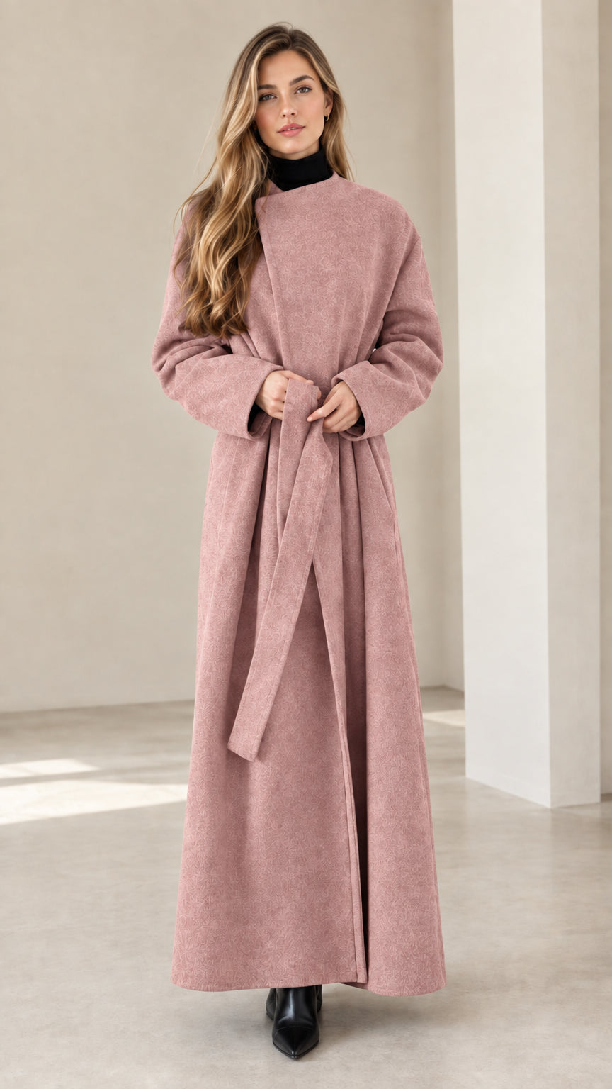 Model wearing dusty rose maxi wrap coat with tied waist belt