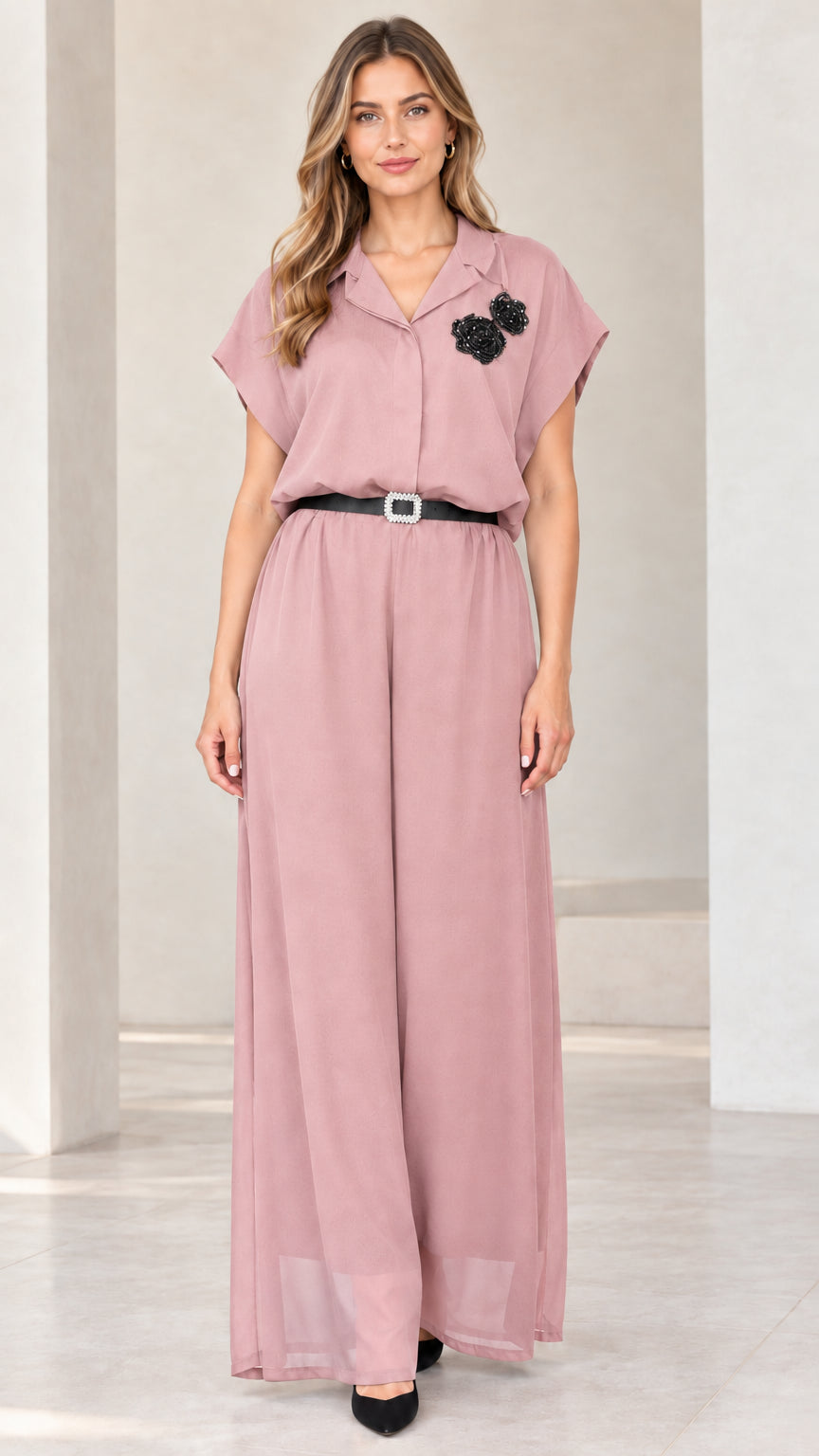 Front view of woman wearing dusty pink belted wide-leg formal jumpsuit