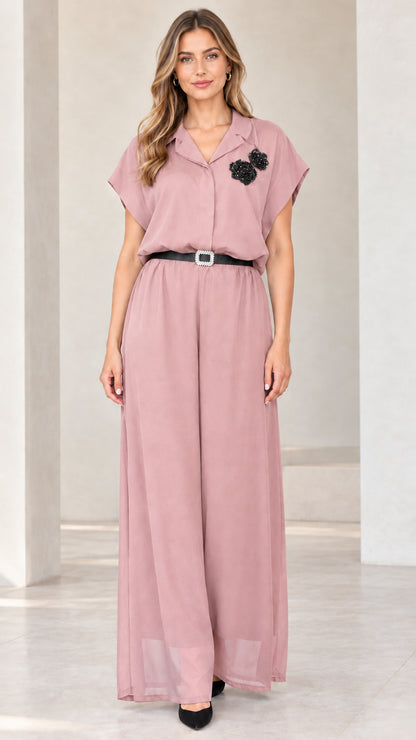 Front view of woman wearing dusty pink belted wide-leg formal jumpsuit