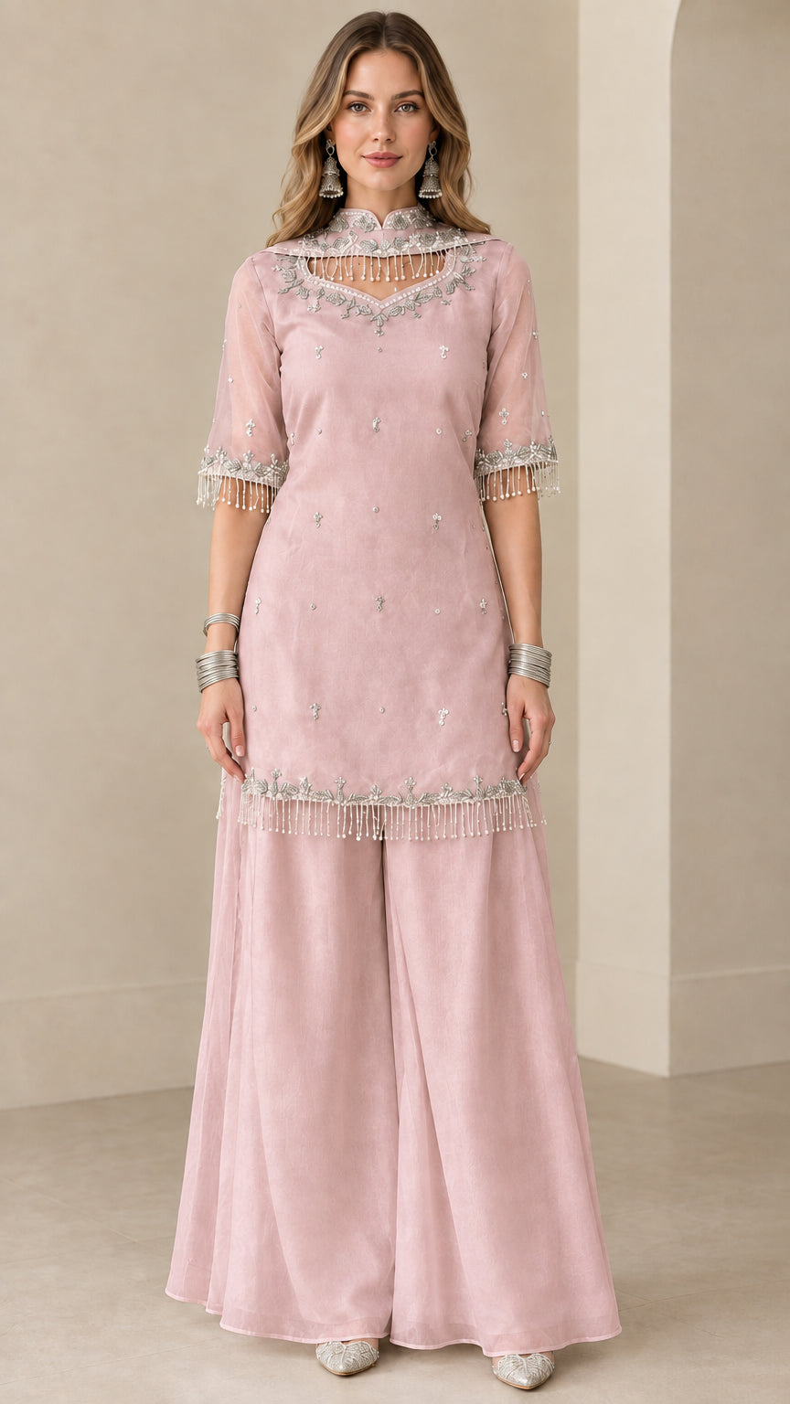 Front view of blush pink embroidered kurti sharara suit set