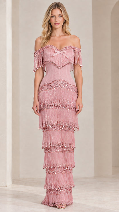 Front view of blush pink off-shoulder tiered fringe maxi evening dress