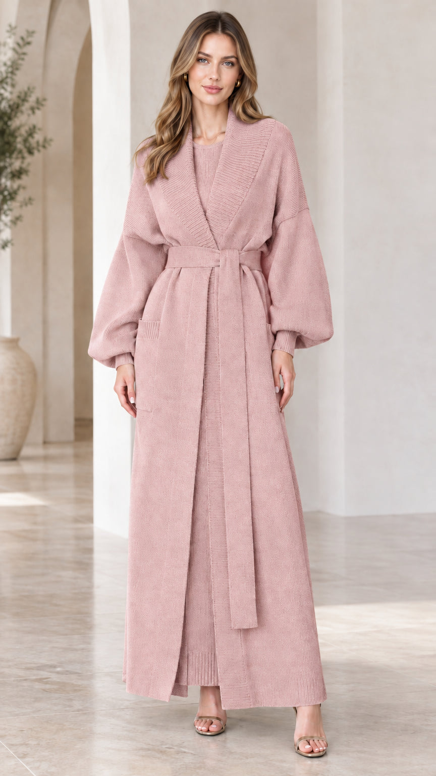 Full-length view of woman wearing dusty pink belted maxi knit cardigan and dress set