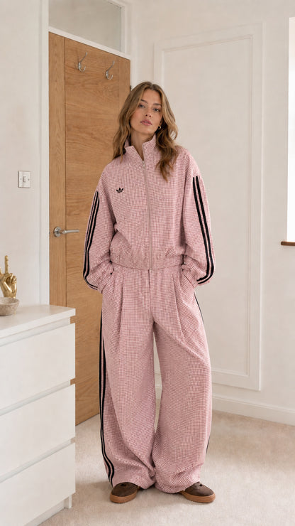 Pink gingham women's track stripe jumpsuit shown from the front