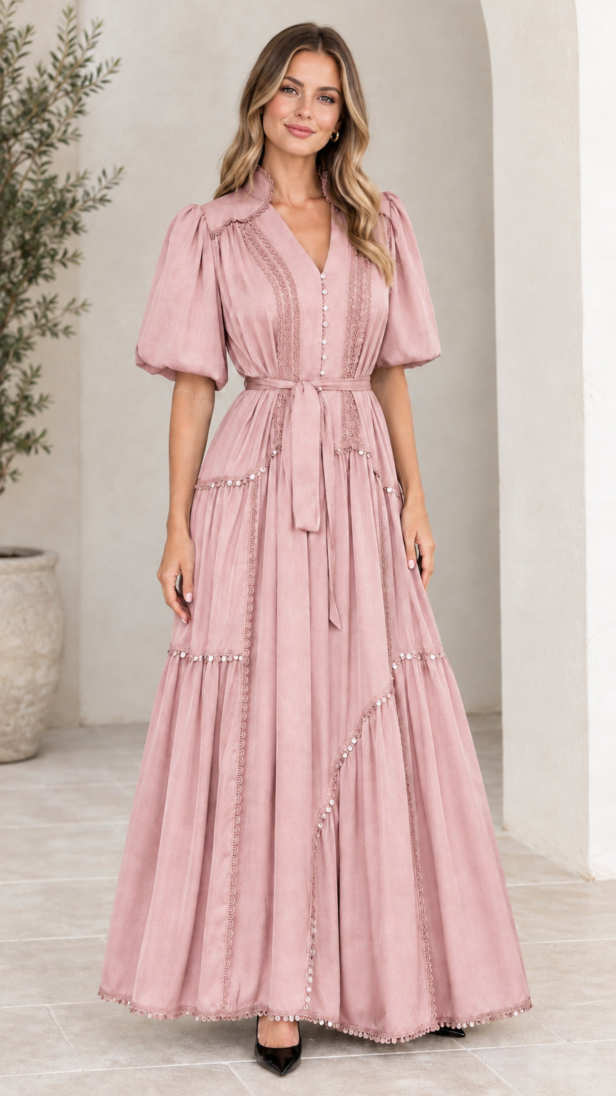 Front view of woman wearing dusty pink V-neck tiered maxi dress with puff sleeves