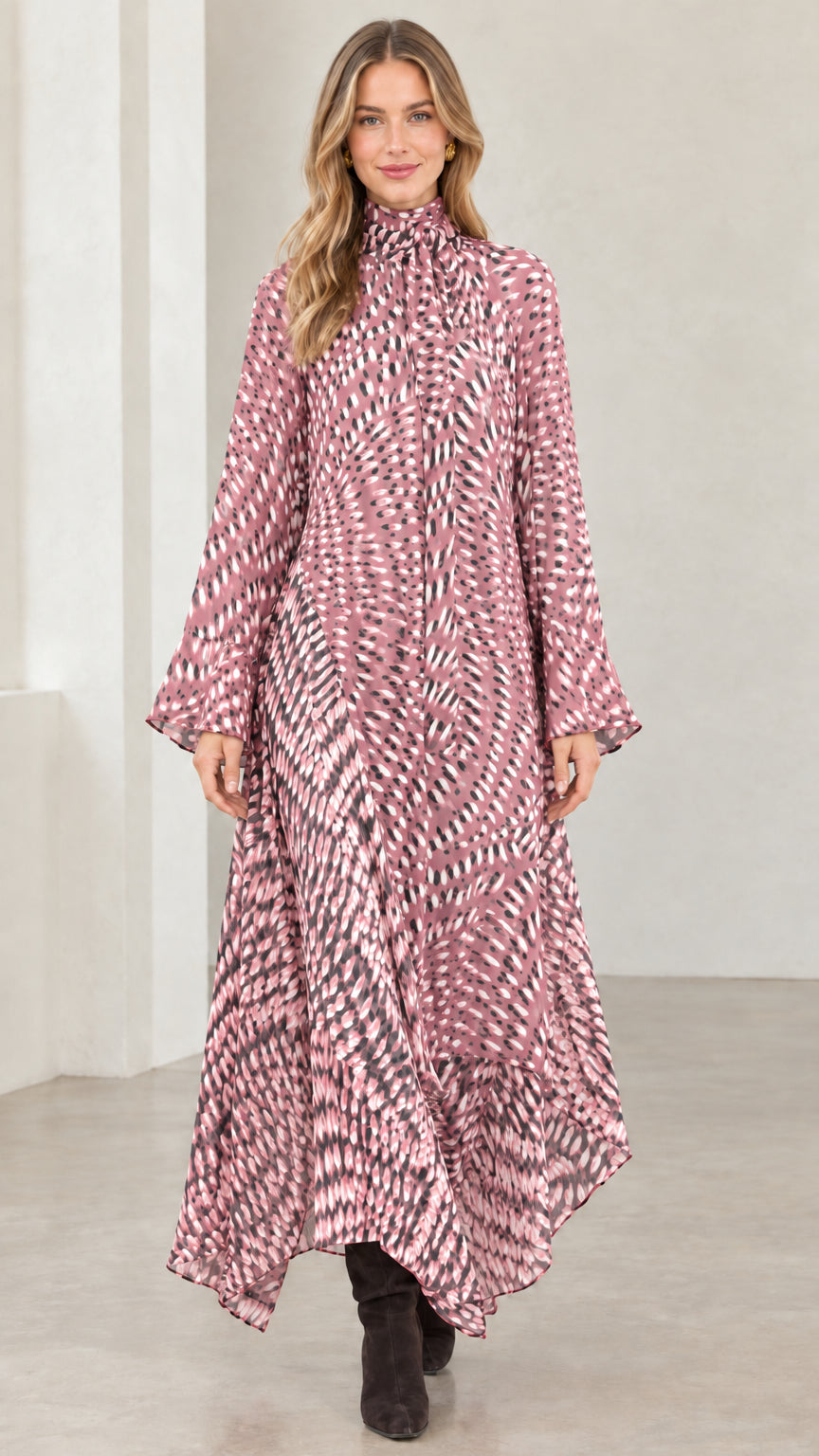 Model wearing dusty pink abstract print high neck flowy maxi dress