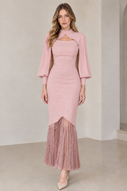 Model wearing dusty pink high neck cape sleeve midi dress with matching pink fringe