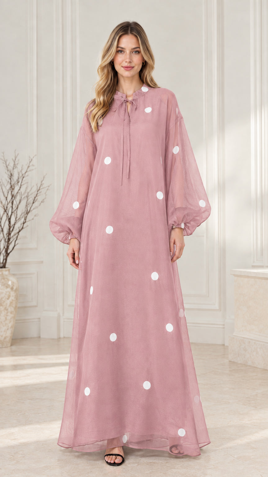 Front view of dusty pink polka dot long sleeve maxi dress