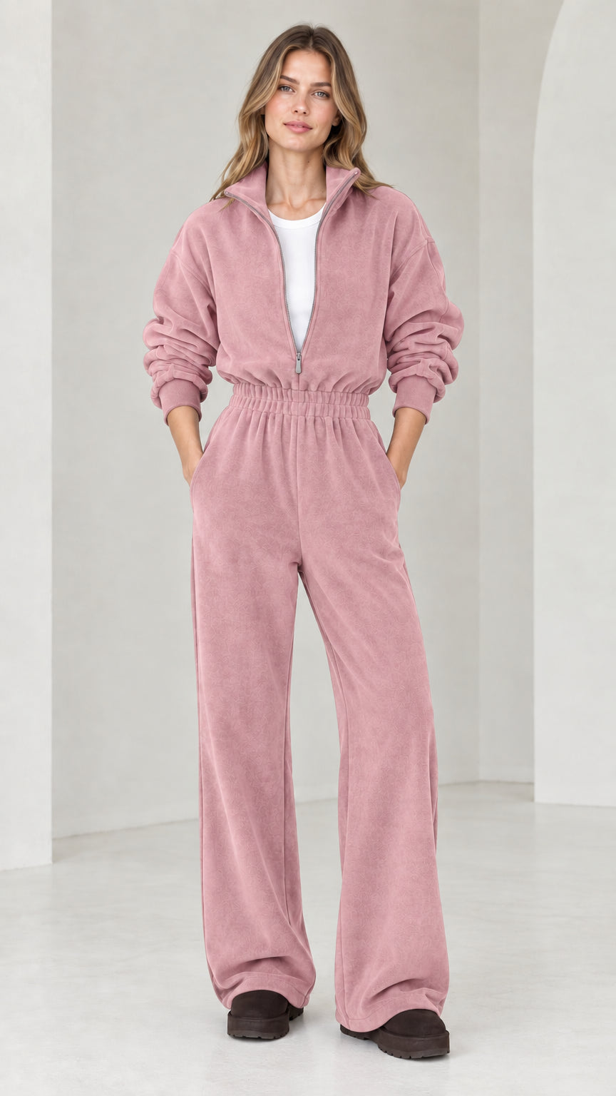 Front view of model wearing dusty rose pink half-zip wide leg fleece jumpsuit