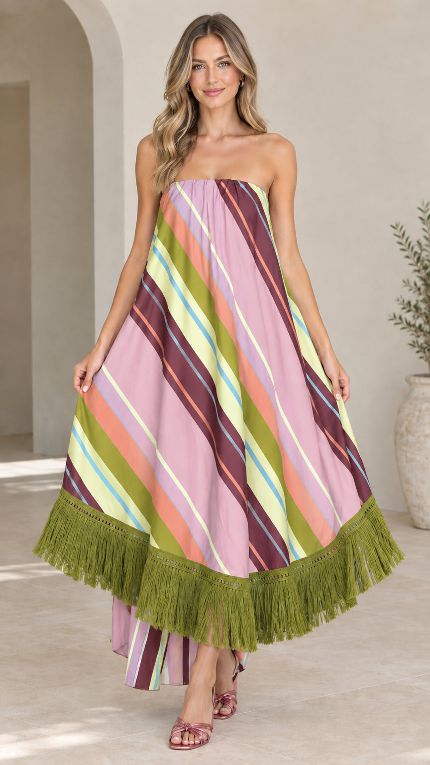 Front view of woman wearing lilac pink striped strapless maxi dress with olive green fringe