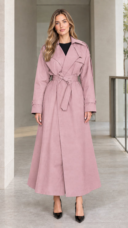 Front view of model wearing Dusty Pink full-length belted maxi trench coat
