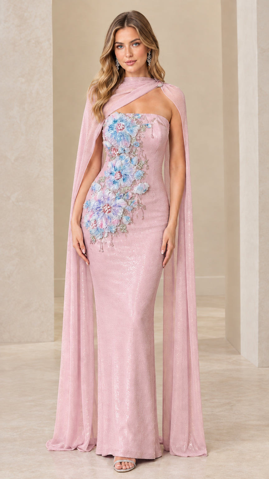 Blush pink formal gown with floral appliqués and flowing chiffon cape overlay