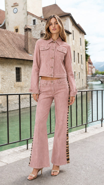 Model wearing Dusty Pink cropped denim jacket and flare jeans set with contrast side tape