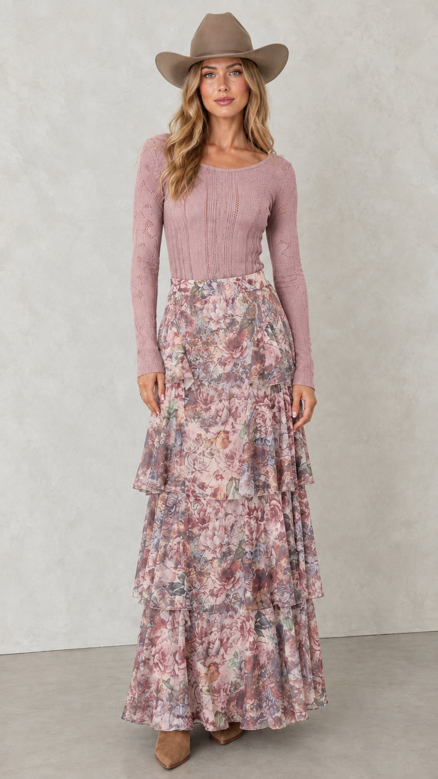 Model wearing Dusty Rose tiered floral maxi skirt with pink knit top