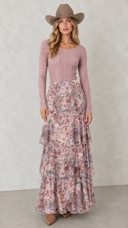 Model wearing Dusty Rose tiered floral maxi skirt with pink knit top