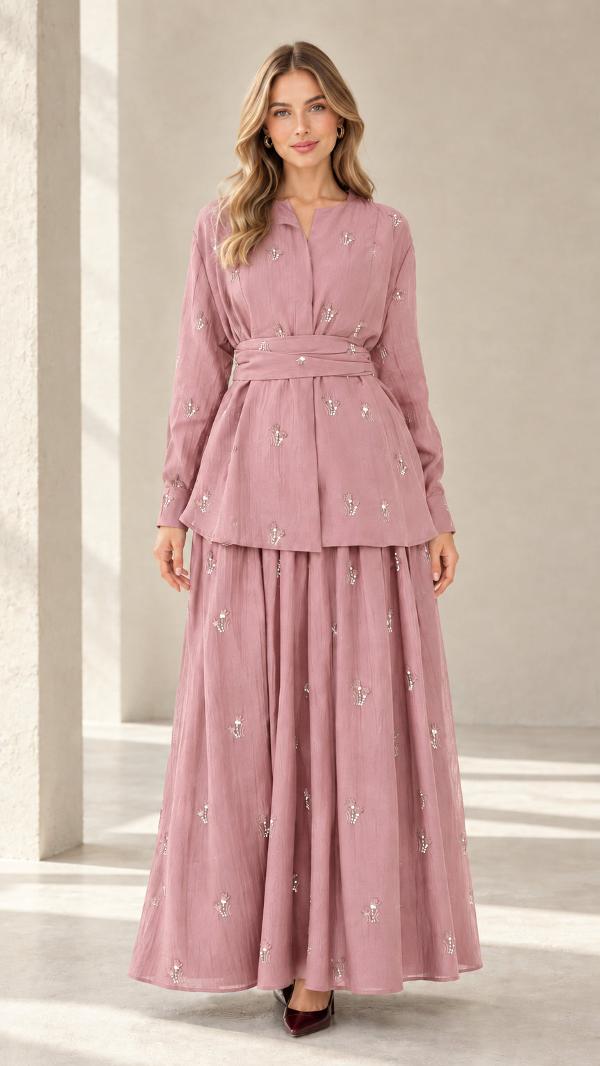Model wearing dusty rose pink modest two-piece embroidered tunic and skirt set