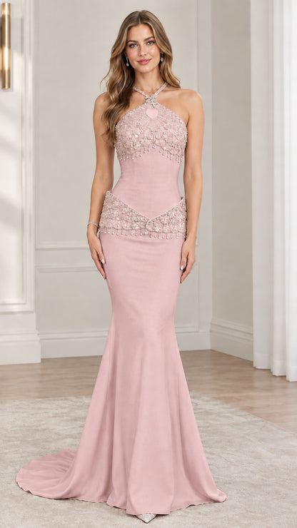 Front view of model wearing blush pink halter beaded mermaid evening gown